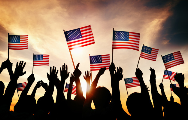 A group of people waving the American flag